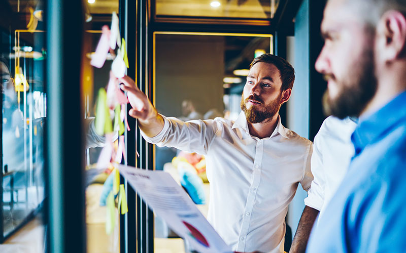 Focused businessman explaining project to colleagues